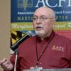  John E. Grimes